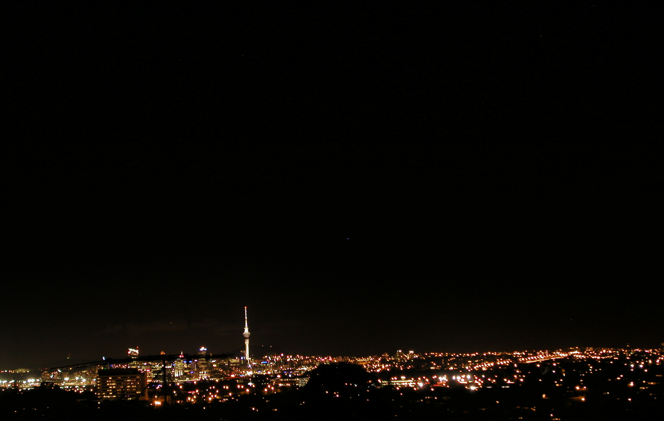 Auckland at night. The best city in New Zealand to start or end your campervan adventure
