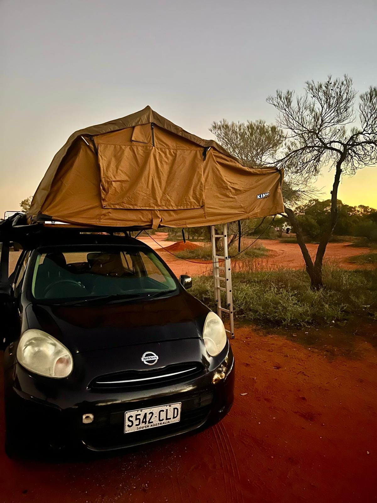 Wicked Budget Mini Camper with rooftop tent at an outback campsite