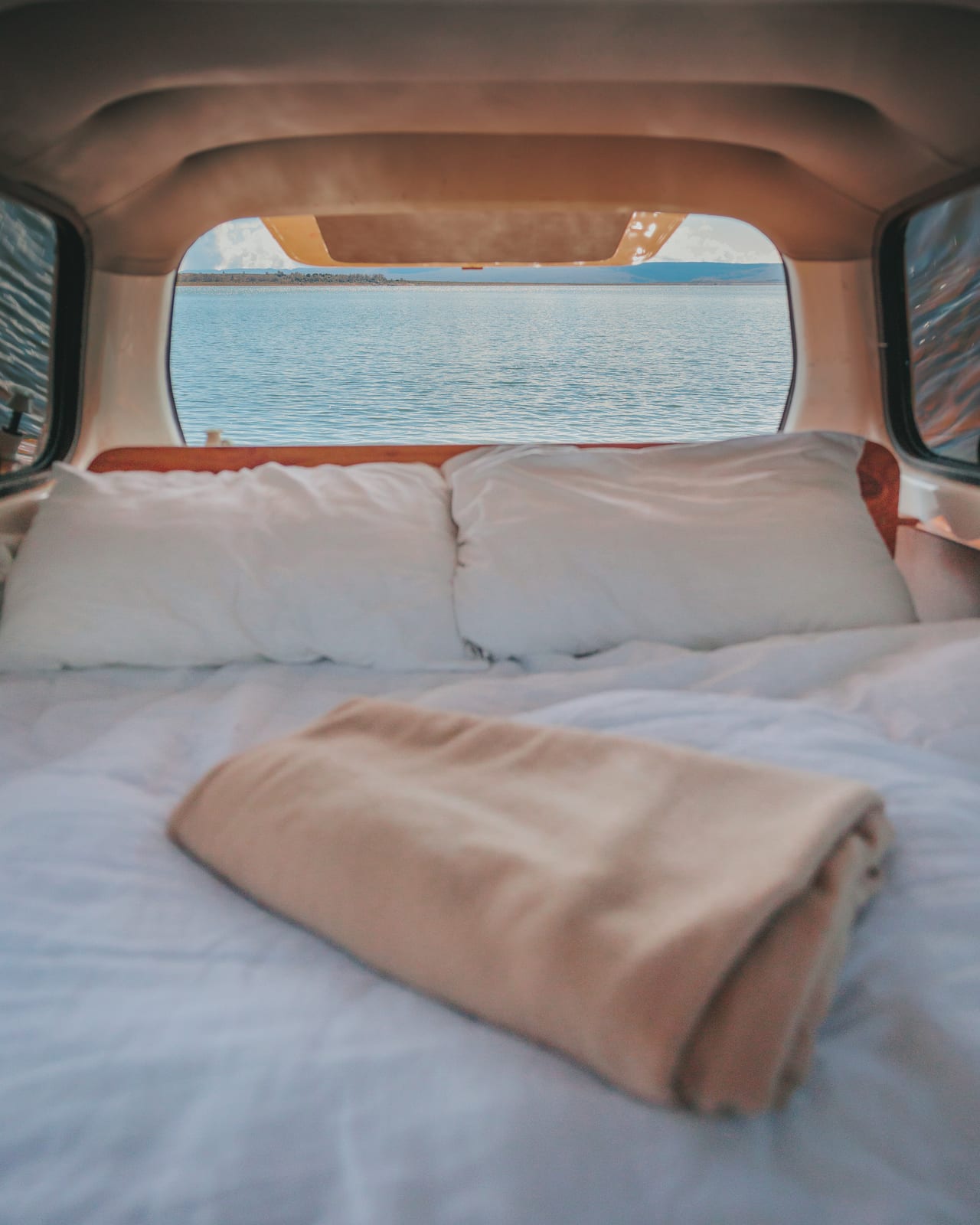 Mystery Machine 2 campervan bed with ocean view